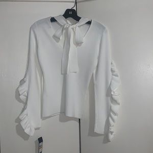 NWT White eggshell color top size Small. Never worn.